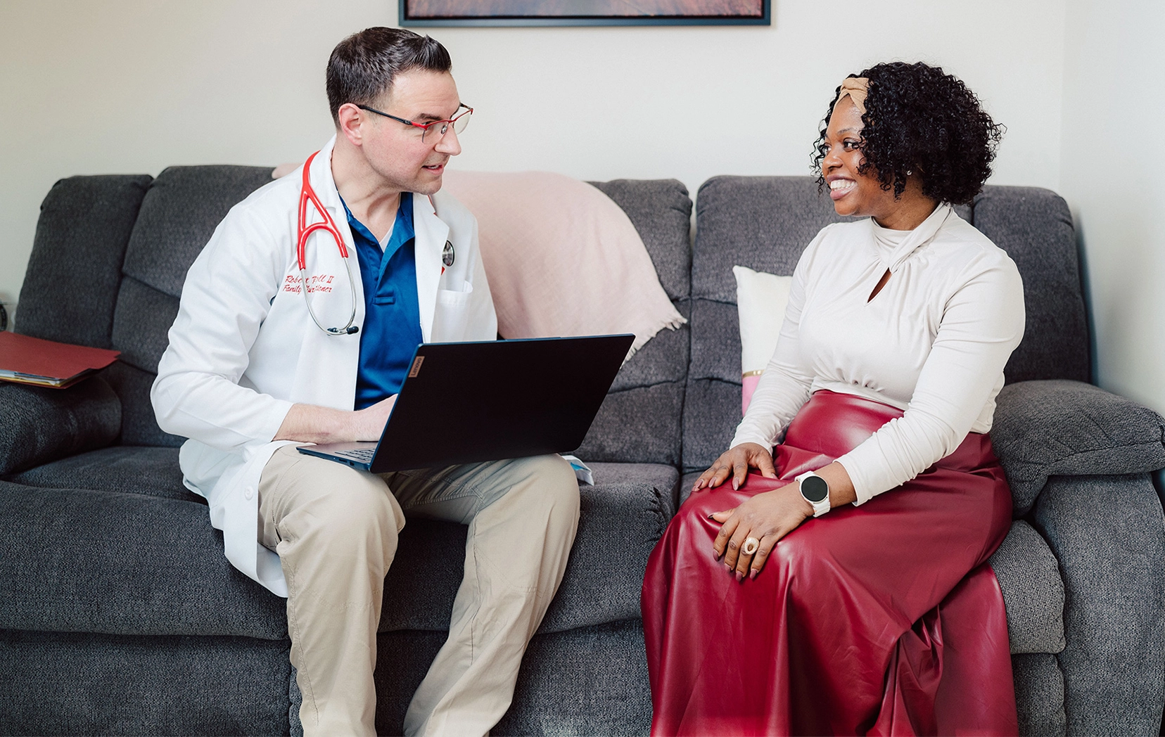 Doctor discussing health with a patient during a primary care visit