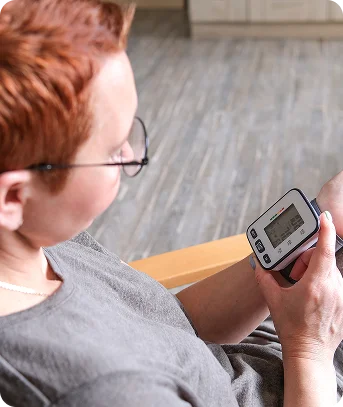 Senior woman recording vitals for RPM